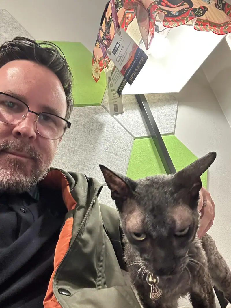 Raymond selfie beside a brindle French bulldog indoors, Long Beach dog walker